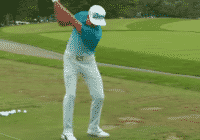 Rickie Fowler warming up for a round range balls alignment stick